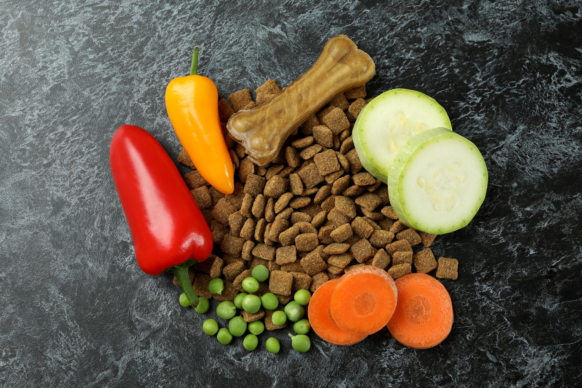 Concept of natural pet food on black smokey background