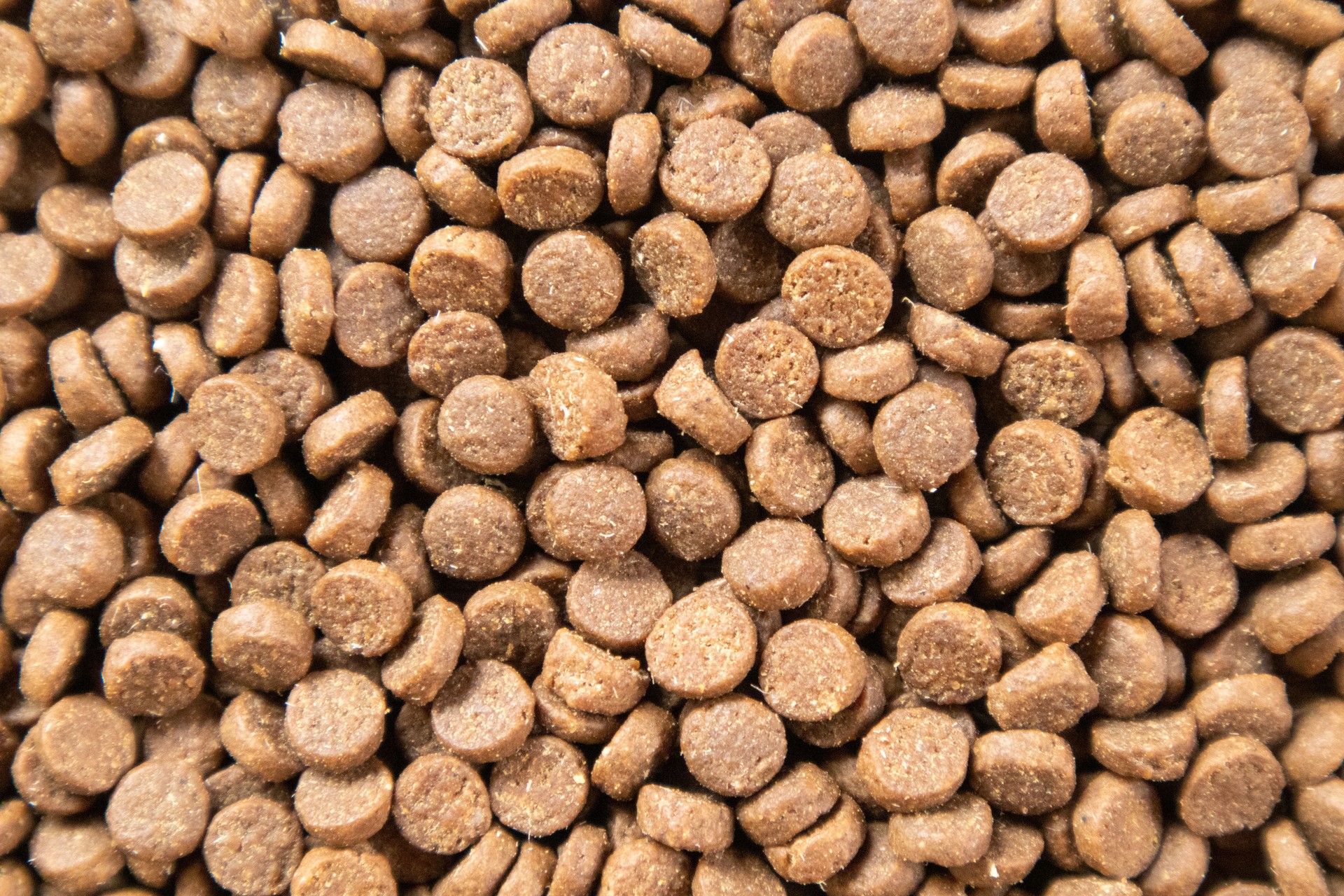 Brown pellet-based pet food for dogs and cats packed with important minerals and vitamins.